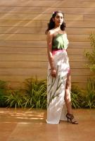 SS17B2- A striking maxi skirt with a patchwork Eucalyptus tree motif and a thigh-high slit that reveals a light pink inner skirt